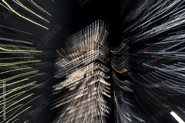 Obraz Nighttime Skyscraper with Radiating Light Trails