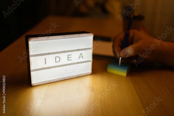 Obraz Generating idea with lightbox and hand writing notes