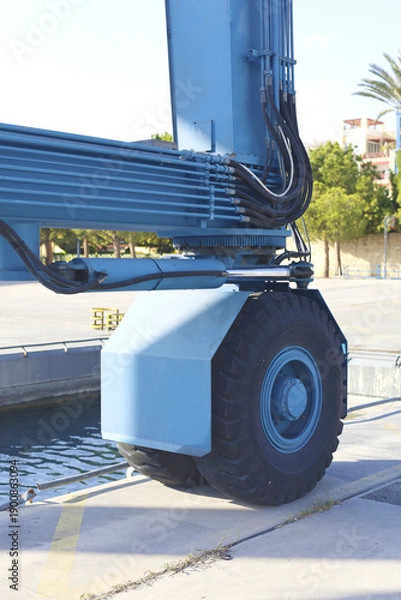 Obraz Large Blue Harbor Crane Wheel Closeup