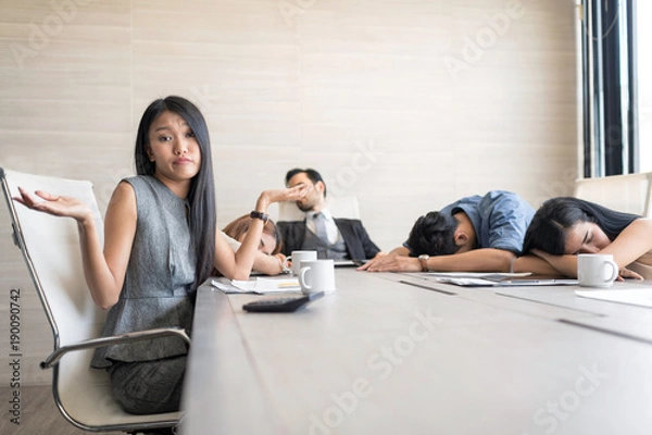 Fototapeta In selective focus of Business people sleeping in the conference room during a meeting. Setup studio shooting.