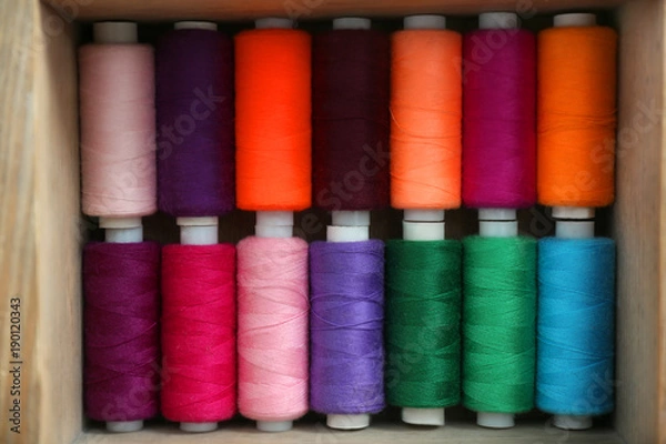 Obraz Set of color sewing threads in wooden box