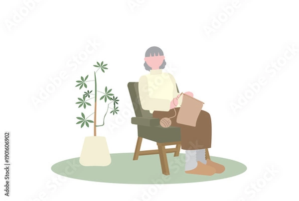 Obraz 一人かけソファで編み物をするシニア女性