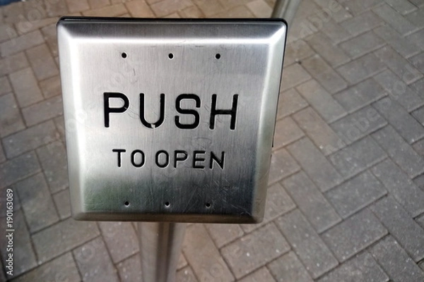 Obraz Push button to allow wheelchair users to open an automatic door. Copy space for text