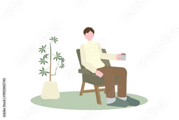 Obraz 一人がけソファでコーヒーを飲む男性