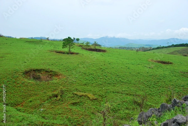 Obraz Bomb craters from the Vietnam War surround giant megalithic stone urns at the Plain of Jars archaeological site in Loas. This area is the world's most heavily bombed place