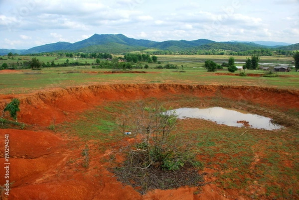 Obraz Bomb craters in the world's most heavily bombed place near the Plain of Jars archaeological site in Phonsavan, Laos