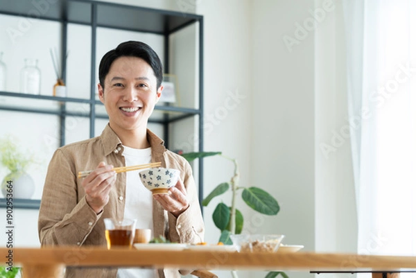 Obraz 朝食を食べるミドルの男性