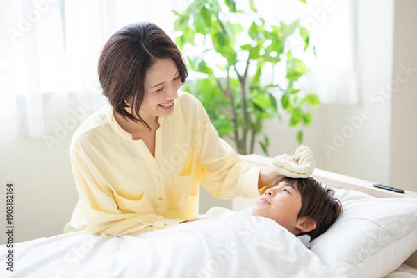 Obraz 息子の看病をする母親