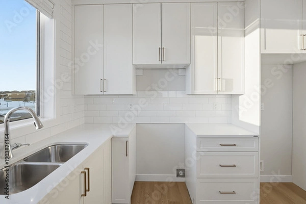 Obraz Kitchen with white cabinets and a sink