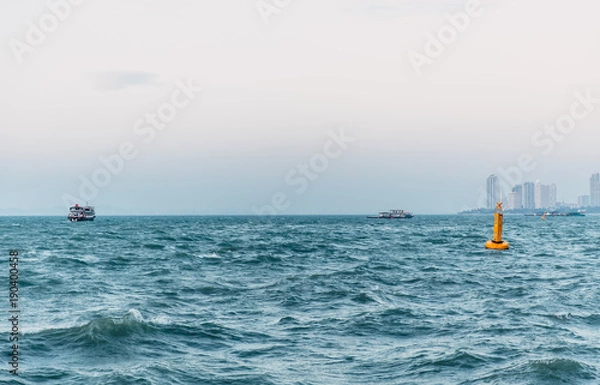 Fototapeta calm sea ocean city coast skyline in evening view seascape
