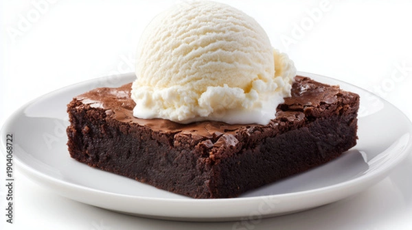 Obraz 白い皿に盛り付けられた冷たいバニラアイスクリームを添えた濃厚でしっとりとした焼きたてチョコレートブラウニー