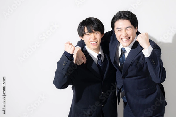 Obraz 受験を先生や講師と一緒に合格頑張るぞ～の個別指導などのイメージ　カメラ目線ガッツポーズ　コピースペースあり