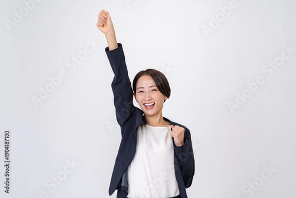 Obraz 腕を高くあげるビジネスウーマン
