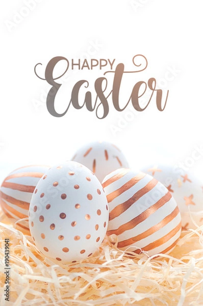 Fototapeta Happy easter postcard banner. Golden Easter eggs in straw nest on white background.