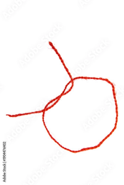 Fototapeta Red thread isolate on white background. Selective focus. Old.