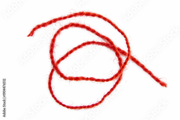 Fototapeta Red thread isolate on white background. Selective focus. Old.