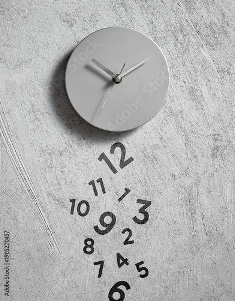 Obraz Minimalist clock with falling numbers representing time passing