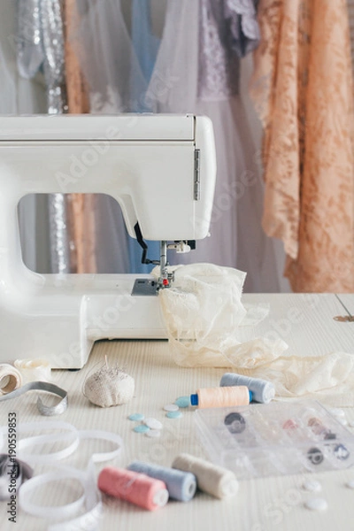 Obraz Modern sewing machine with threads on table