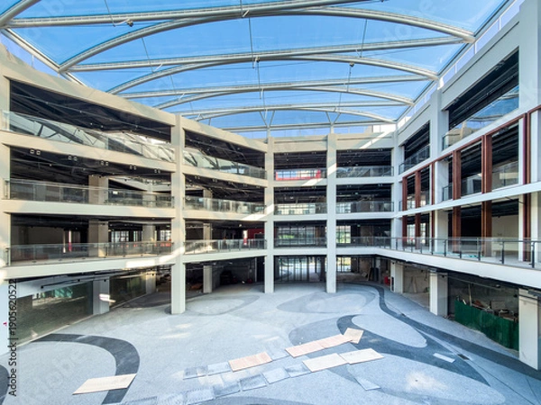 Obraz Striking Modern Architecture Featuring Red Escalators in a Spacious Atrium