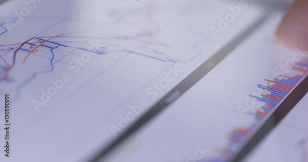 Fototapeta Stock market data on tablet computer