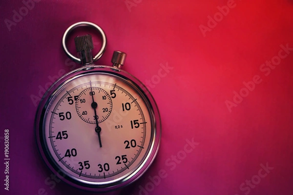 Fototapeta Old stopwatch isolated on paper bright background top view