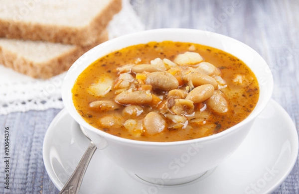 Fototapeta Soup of white bean   in a white plate