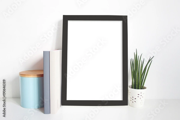 Obraz A4 portrait black frame on desk