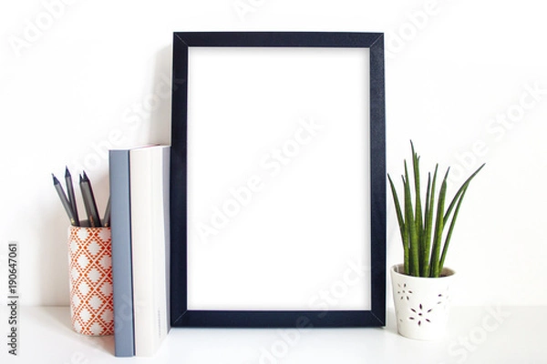 Obraz A4 black portrait frame on desk