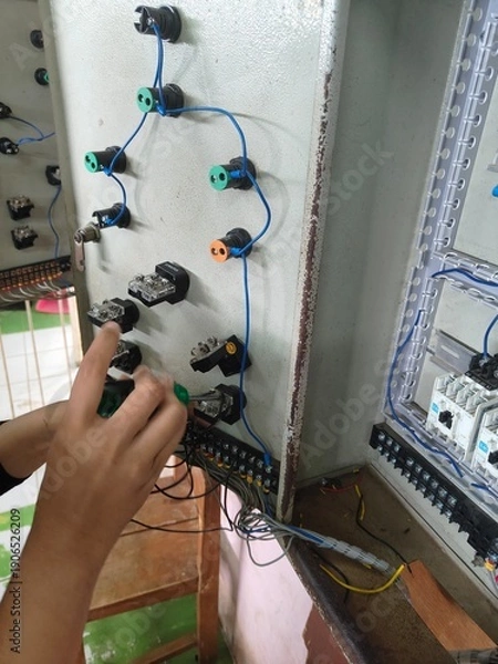 Obraz electrical circuit work on the electric motor installation panel