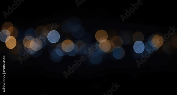 Obraz Dazzling bokeh patterns over a deep dark background