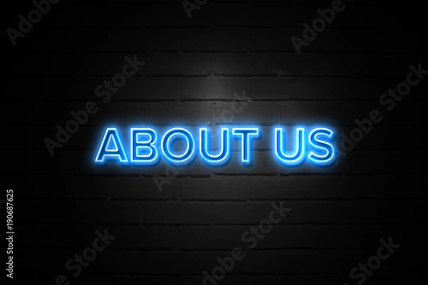 Obraz About Us neon Sign on brickwall