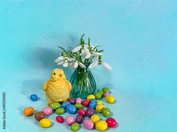 Obraz Easter eggs with flowers and chicks on a blue background