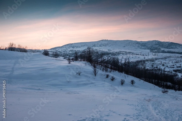 Obraz snowy hill at colorful sunset