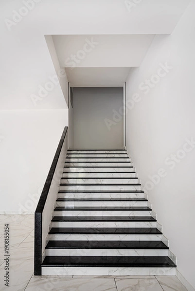 Obraz Minimal white interior staircase with marble steps and handrail