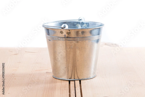 Obraz gray metal bucket on a white background