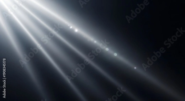 Fototapeta Light rays shining through darkness.