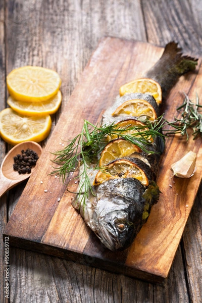 Obraz grilled fish with spices and lemon