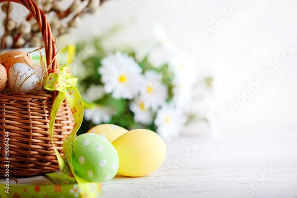 Fototapeta Happy Easter. Congratulatory easter background. Easter eggs and flowers.
