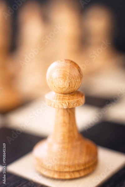Obraz chess pieces on a chessboard on a dark background