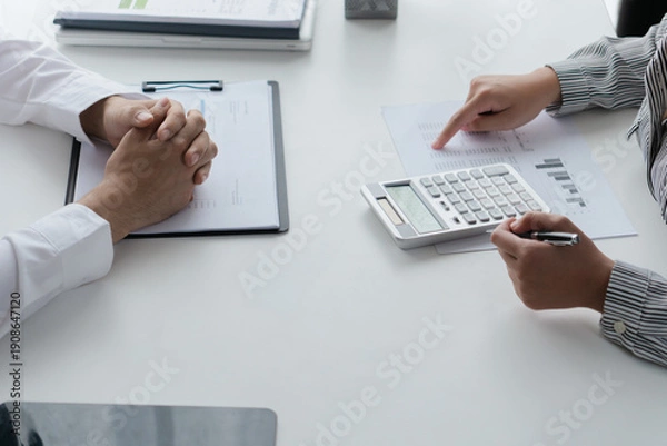 Obraz Professional accountant analyzing documents in office for precise valuation