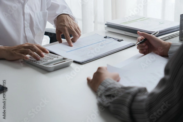 Obraz Professional accountant analyzing documents in office for precise valuation