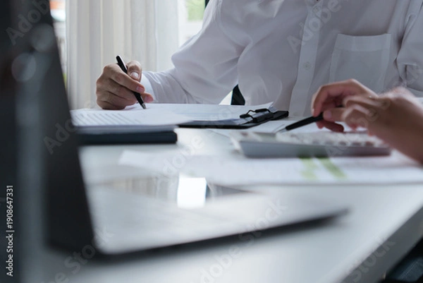 Obraz Accountant assessing numbers in office for precise valuation documents