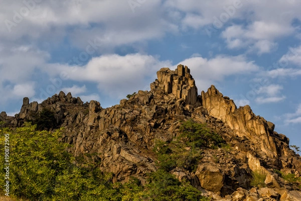 Fototapeta Beautiful landscape with rocks and clouds in a warm light,Dobrogea, Romania