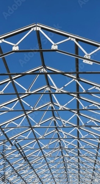Obraz Metal Greenhouse Structure Under Blue Sky.