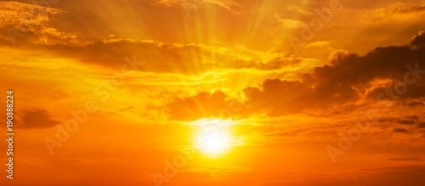 Fototapeta background  panorama scenic of the strong sunrise with silver lining and cloud on the orange sky