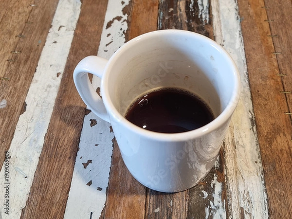 Obraz It is a mug with some coffee in it.