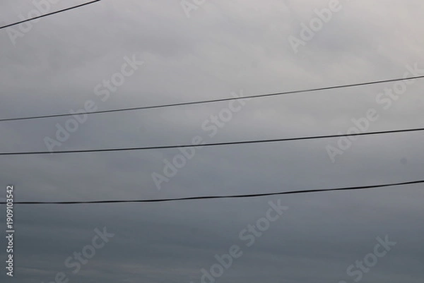 Obraz wires against a cloudy sky,