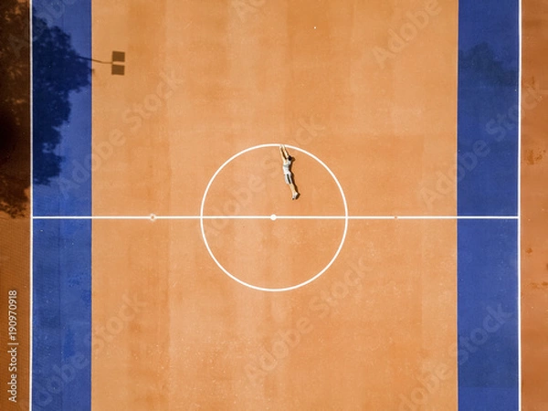 Fototapeta drone view of a man in a football court