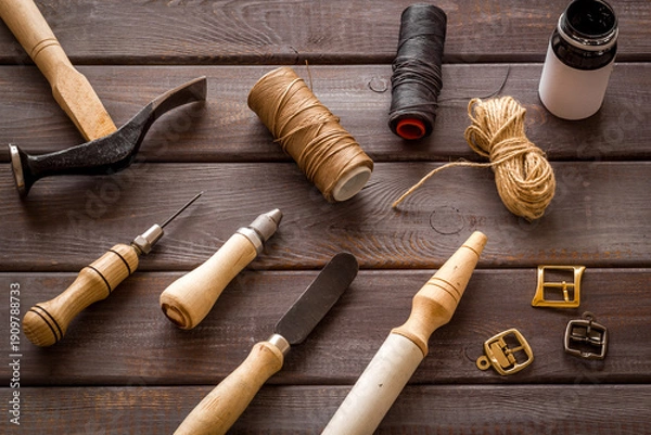 Obraz Leather craft work tools flat lay. Tailor or shoemaker on workplace, top view