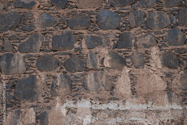 Obraz Ancient rustic volcanic stone wall texture background for design